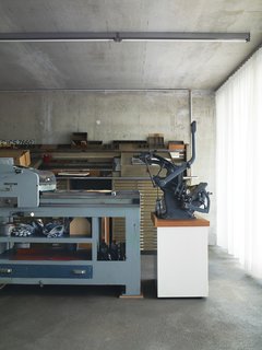 The "cellar," where the couple keep printing presses, was built on the fourth floor, above the office spaces. For zoning purposes, this floor has a low ceiling height.