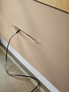 Cloth panels hide messy outlets and plugs.