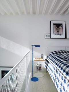 The bedroom has no wall to divide it from the rest of the building; blackout curtains can shut out the light entirely.