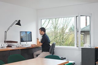 The home is conducive to both work and play–— Waechter attends to business in his home office.
