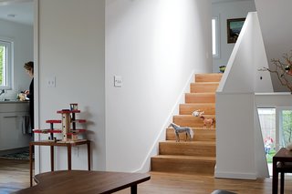 "To maintain the seamless connection from room to room, it was important that the flooring material was the same throughout the house," Waechter says. "We took that continuity down to the smallest detail, eliminating the nosing so the treads look like a folded floor rather than a stair made up of treads and risers."