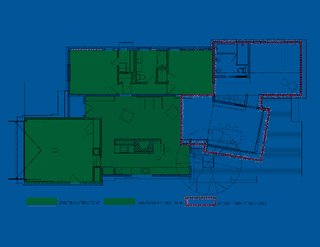 The floor plan reveals the existing house, in green, and the addition, bordered in red. The angle of the lantern "was a pretty intentional shift on our part," says Misra. "First we had it parallel to the barn on plan, but we tweaked it a little and gave it an angle, because when standing on the patio and looking out to the pool, the sightline is best this way. In a parallel format, the patio and pool felt a little close, and this way we were able to maximize the spacious feeling by playing with the angles slightly." Image courtesy Chinmaya + Apurva: Collaborative