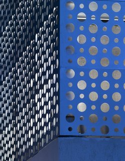A Modern Aesthetic in Mumbai - Photo 5 of 17 - The aluminum cladding was left its original silver color; Khanna and Schultz note that it reflects the surrounding colors and can read anywhere in the spectrum from blue to white.