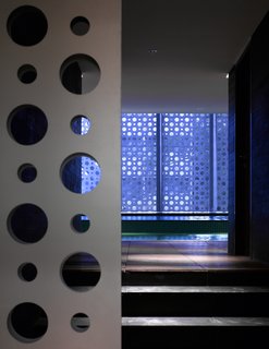 A Modern Aesthetic in Mumbai - Photo 11 of 17 - The sliding-gate entrance to the residents' private, 4,900-square-foot pool and gym area.