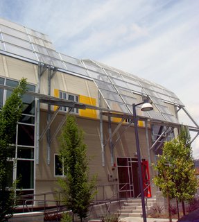 The awning over the old pasta factory's entrance shades the east facade from the sun's rays.