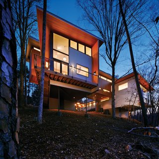 The complex, perched on a slope overlooking a forest owned by Duke University, has an 800-square-foot artist’s space and a 2,400-square-foot house.