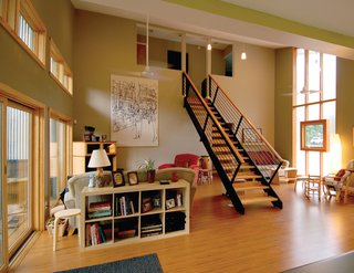 Three factory built modules were set apart so that the spanning site-constructed roof affords generous living space below. The family regularly gathers in this light-filled living area flanked by abundant north and south glazing.