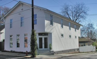 Designed by John Reese Architect this downtown grocery store landmark was redesigned as a single-family residence and retains the traditional neighborhood character.