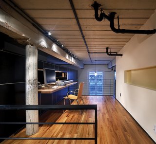The addition of a loft increases square footage, providing a larger, more private office/workspace.