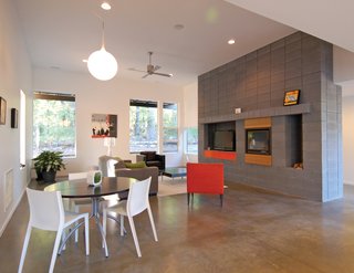 A concrete block hearth serves as the focus of the main living area as well as the delineation of the main entrance.