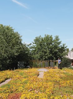 Just up a ladder is the green roof, which is planted with maintenance-free sedums and tall grasses near the patio that Monkman tends carefully.