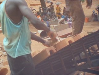 "In Comparison," a video by Harun Farocki, shows traditional construction methods in Burkna Faso, the same techniques used in Kere's project.