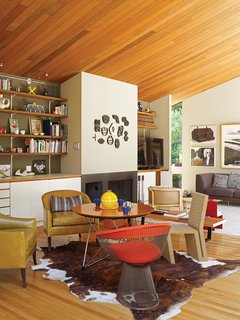 From another angle, a different Easy Edges chair is visible, this time, in the company of a Warren Platner for Knoll chair and two leather seats.