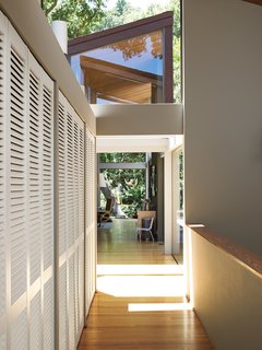 The bridge leads from the living room to the bedrooms and from the studio to the garage.