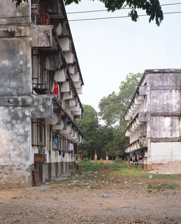 Living in Laos - Photo 7 of 14 - These buildings and the Institute were built on land "appropriated" by the government from Wat Sok Pa Luang (Forest Temple). This used to be a forest area outside Vientiane and is now very much part of the city.