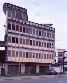 Living in Laos - Photo 11 of 14 - Two shots of one of my favorite buildings in Vientiane. It sits between two streets, Samsenthai Road and a smaller street with no name that I could find. It looks like a different building depending on which street you are standing on.