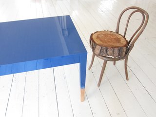 Khemsurov: "The blue table is a precursor to Trift, developed in 2008 for Milan's Post Design Gallery. The chair, however, is a kind of inside joke — Seng acquired the broken Thonet frame from her grandmother's house eight years ago, and Valder kept begging her to fix it or throw it out. The feud was resolved during the move in May, when someone rested one of Seng's stumps on the chair's seat by happenstance. "Now we love it," says Valder."