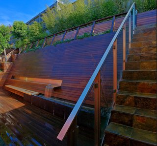 For a steeply sloping backyard in San Francisco, he devised this all-in-one wooden wall, which provides seating, a fountain that helps block out highway noise, and, at the top of the steps, a lookout point that offers a view on the surrounding neighborhood.