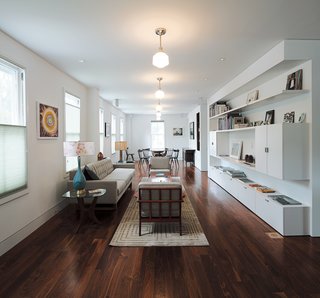 The living-dining room replete with a Wells sofa from Room and Board, occupies what was formerly a classroom.