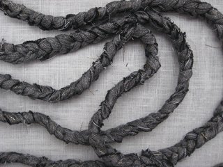 Braided Rag Vessels - Photo 3 of 14 - 2. Braid the strips together. The final braid will need to be about 10' long, but it is best to work in 36" segments. Sew additional strips to the end of braided strips as you go until you achieve the total length.