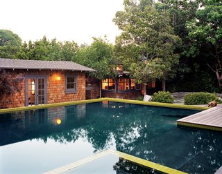 Before the addition of the approximately 750-square-foot pool (and its 65-square-foot hot tub), the lot was a scramble of structures: the house in one corner and the guesthouse and the office each occupying another.