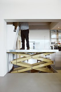 This Home Takes Recycling to the Next Level - Photo 2 of 13 - The recycled builder's elevator is a practical touch, and allows easy transportation of artwork and furniture between floors.