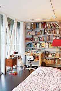 This Home Takes Recycling to the Next Level - Photo 7 of 13 - The cozy spare room filled with heirlooms is largely used by the couple's three young grandchildren.