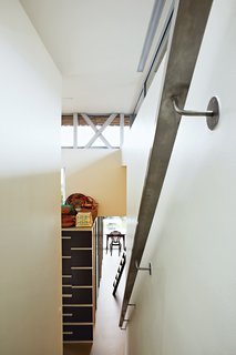 This Home Takes Recycling to the Next Level - Photo 13 of 13 - The steel frame of the house was entirely recycled from mill machinery formerly employed in the region's textile industry, which has since declined. Leaving the steel skeleton visible in places, as here, makes a tangible link with local history.