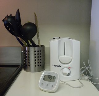 The Belkin Conserve Insight taking a reading of our refrigerator. The number jumped up and down depending on how hard it was working to maintain the internal temperature—ranging from 900-plus watts after we'd had the door open for a minute to 0 watts after it reached its set temperature.