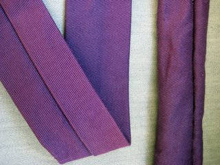 Once your strap has been turned out, iron it flat so that the seam runs down the center. This will be the inside of your sling. In this pic, you can see the pre-and-post-ironed strips.