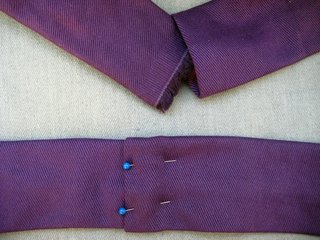 Fold one end of the strap under about 1/3 of an inch, then slip the other end in about the same amount. Pin the two together and sew along the seam.