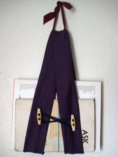 The sling in action. Lotta used hers for trays in Handmade Modern, but I've found that it's perfect for an easy-to-reach bedside book holder.