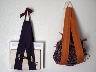 Anything goes! Sling away! Here's the purple guy with an orange one I made over the holidays. I tossed my knitting in there (it worked because those skeins are pretty hefty), but you could just as easily stash a notepad, incoming/outgoing mail, magazines.... you name it. Have fun!