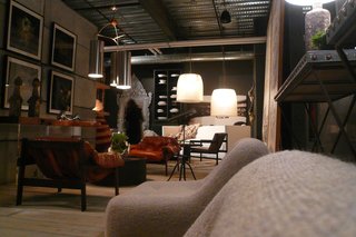 The 8,500-square-foot interior is filled with an eclectic mix of industrial, modern, and antique furniture.