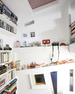 Ionescu’s room has built in shelving for his eclectic collections. "We embrace everything—new, old, anything that embraces the truth in architecture," says Ionescu. "We’ve been compared to the Deconstructivists, but we like things that are decorative or made by hand—16th century objects, Art Nouveau, anything that has an aesthetic truth to it."