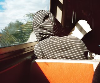 A subway rider takes a rest.