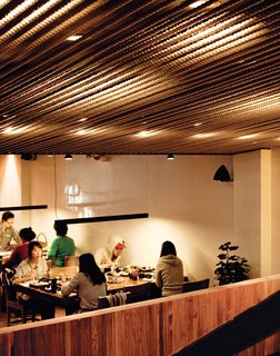 With its orderly rope-covered ceiling and sleek bars of light, Minnis Shabu Shabu, John Hsu's restaurant, is purposely at odds with Flushing's aesthetic.