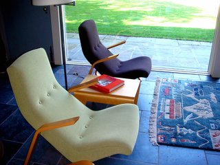 These Saarinen Grasshopper chairs were recently reupholstered with Knoll fabrics. The bent plywood nesting table between the chairs was designed by Breuer in 1935, is currently produced by Isokon in London, and was the first furnishing purchased for the restoration. "We used Ezra Stoller's period photography and the registrar's list from MoMA to see what was originally in the house," says Cynthia Altman, Kykuit's Senior Curator. "Luckily because mid-century has become so popular these days pieces are being reissued." Photo by Diana Budds.
