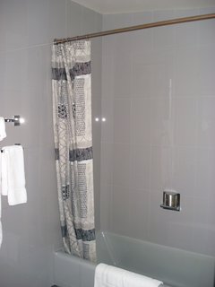 The new iteration of the bathroom features Carrara glass tile, though the original was plywood. Photo courtesy of the Rockefeller Brothers Fund.