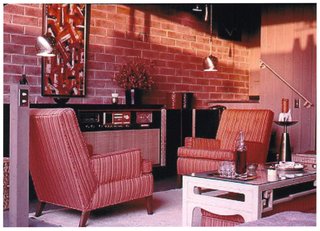 As shown in this picture, we learned that all the wood, inside and out, was a natural ‘driftwood’ grey finish, and the floors were gray linoleum 12 x 12 tile. . (Now the interior wood is natural doug fir and the courtyard wood is painted white). Frank joked that Craig Ellwood did not approve of his furniture! Noticing the painting and the stereo in this picture, I asked him if he listened to "Kind of Blue" by Miles Davis, which was recorded in 1958. But Frank replied that he preferred female vocalists... The light switch pole (which we love) was apparently a concession of the architect to the building department, which required a light switch at the front door. In the Ellwood apartments, there is no formal front door—instead there is a glass wall with sliding doors across the entire façade.