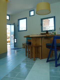 The area between the blocks is public space, with walls much more perforated there to provide lightness for the vacation home. Gradient shades of blue ceramic tiles relate to the blue walls and tiles outside.<br><br>Photo courtesy <br><br>Z-A Studio.