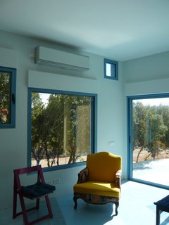 The public space, both inside and out, ripples in blue around the three blocks.<br><br>Photo courtesy <br><br>Z-A Studio.