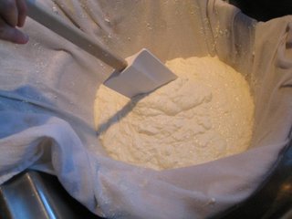 Fresh and Baked Ricotta - Photo 1 of 4 - Joanne's homemade ricotta cheese draining in cheesecloth.
