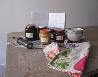 A selection of Carlos Mayor and Antoine Leonetti's homemade jams, their recipe journal, and bowls by Caroline Chevalier.