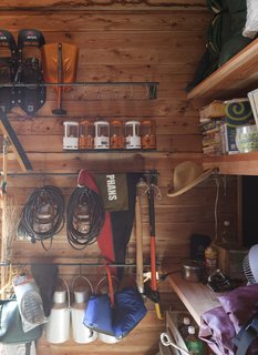 A Platform for Living - Photo 19 of 28 - The building that shelters their bathroom also contains a large pantry and storage closet, filled to the brim with camping and outdoor gear.