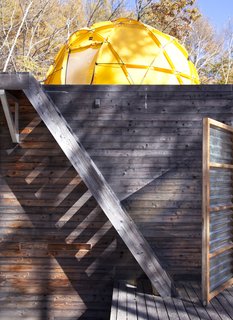 A Platform for Living - Photo 21 of 28 - The yellow North Face tent looms over the top of the main building.
