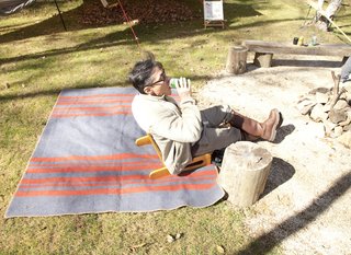A Platform for Living - Photo 22 of 28 - Setsumasa Kobayashi reclines on a striped wool blanket from his 2010 'Horse Blanket Research' line.