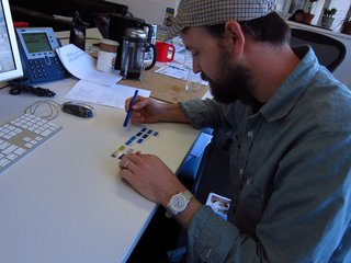 Kyle intently studies the swatches.