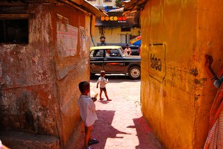 Touring India - Photo 4 of 27 - Perhaps my favorite shot. After being invited into a walkway to dance with a large family in their backyard, I turned, and spotted children with popsicles in hand, and a Taxi, all perfectly framed.