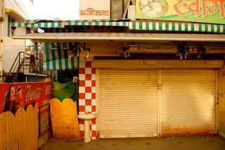 Touring India - Photo 8 of 27 - During the day, storefronts are packed with people. I coveted my time alone in the streets in the morning hours before the hustle and bustle started. These same storefronts, when closed, had a dramatically different energy.